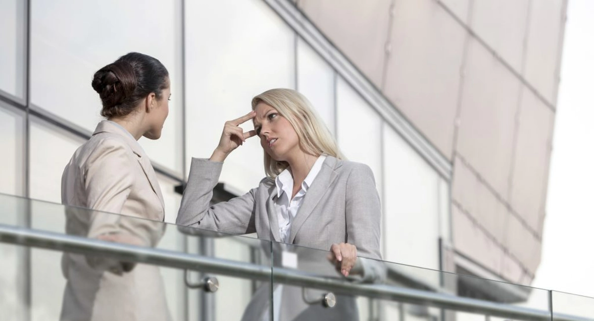 Confused office workers in suits chatting