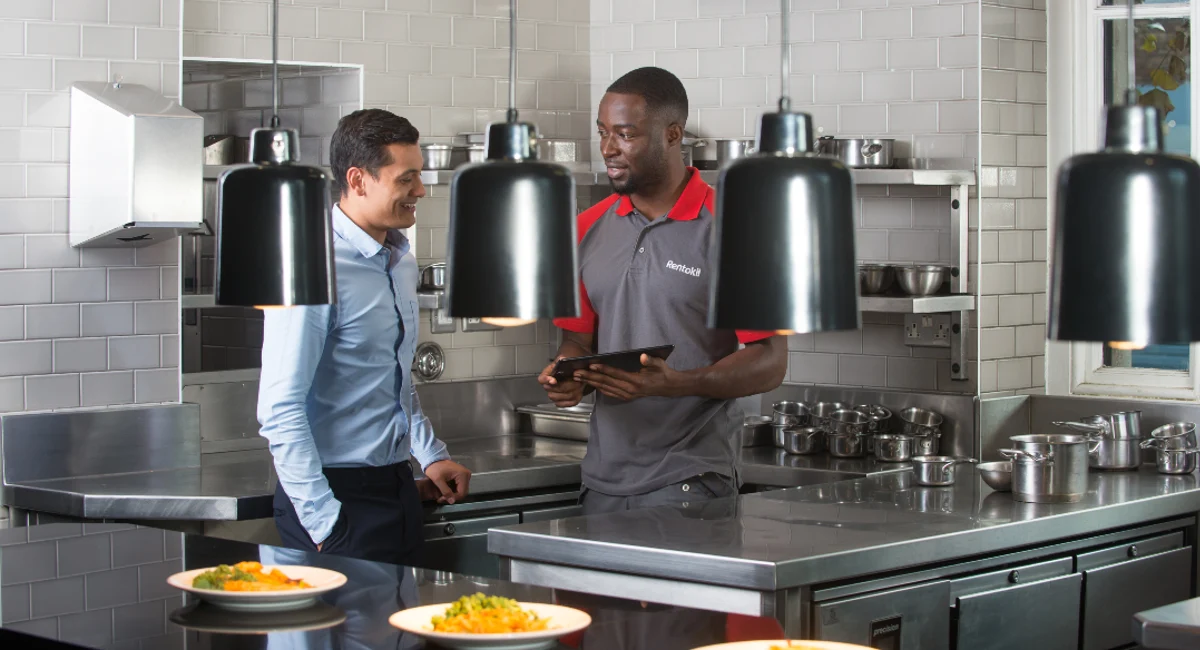 Customer and technician in a kitchen